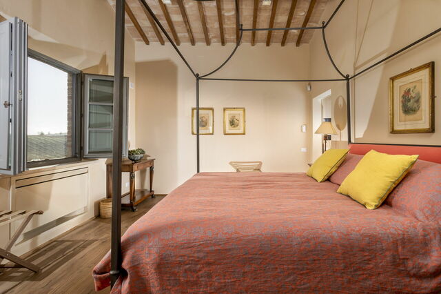 Ein Schlafzimmer im Podere D'Asso