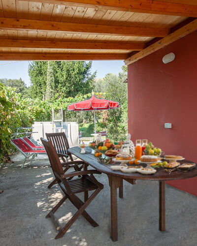Casa Iris - Versilia, Holiday Home with Pool: Möbel, Eigentum, Tabelle, Gebäude, Pflanze, Stuhl, Holz, Schatten, Interior Design, Fenster