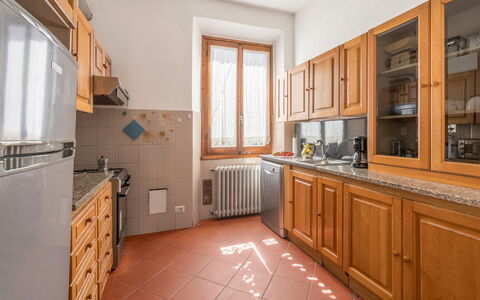 Cascine Apartment In Florence: Küche, Countertop, Holz, Flooring, Küchengerät, Cabinetry, Interior Design, Major Appliance, Decke, Fussboden